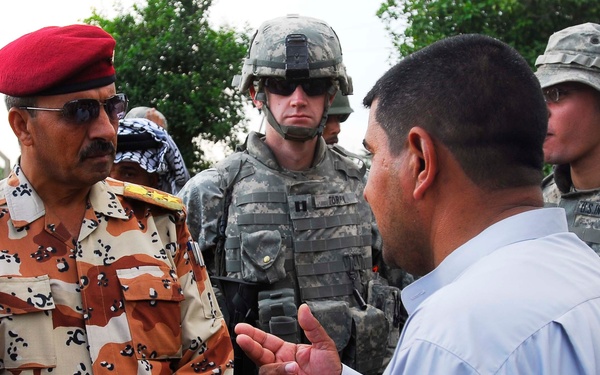 Iraqi Security Forces, Multi-National Division - Center Soldiers celebrate water distribution system