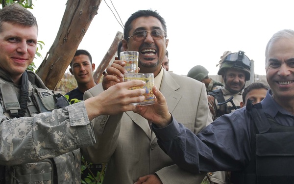 Iraqi Security Forces, Multi-National Division - Center Soldiers celebrate water distribution system