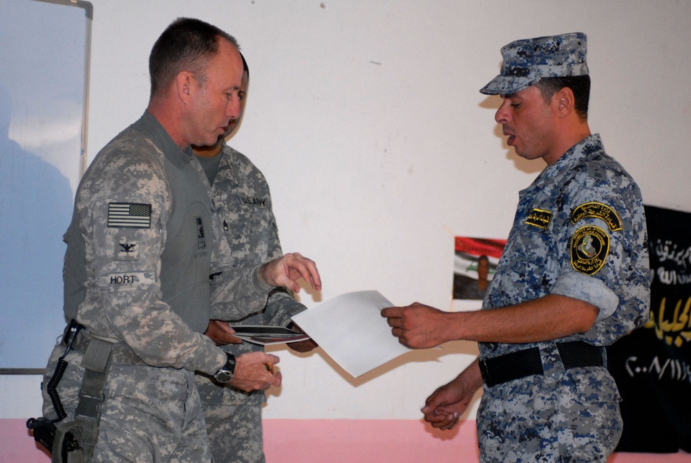 Iraqi men officially join ranks of National Police at ceremony