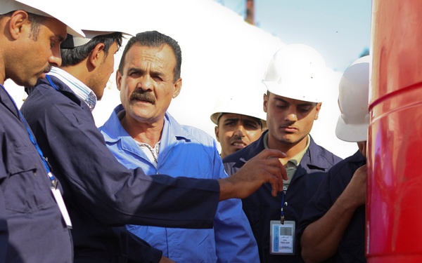 Iraqi government pays its 'Sons': West Rashid Sons of Iraq receive first government of Iraq paycheck