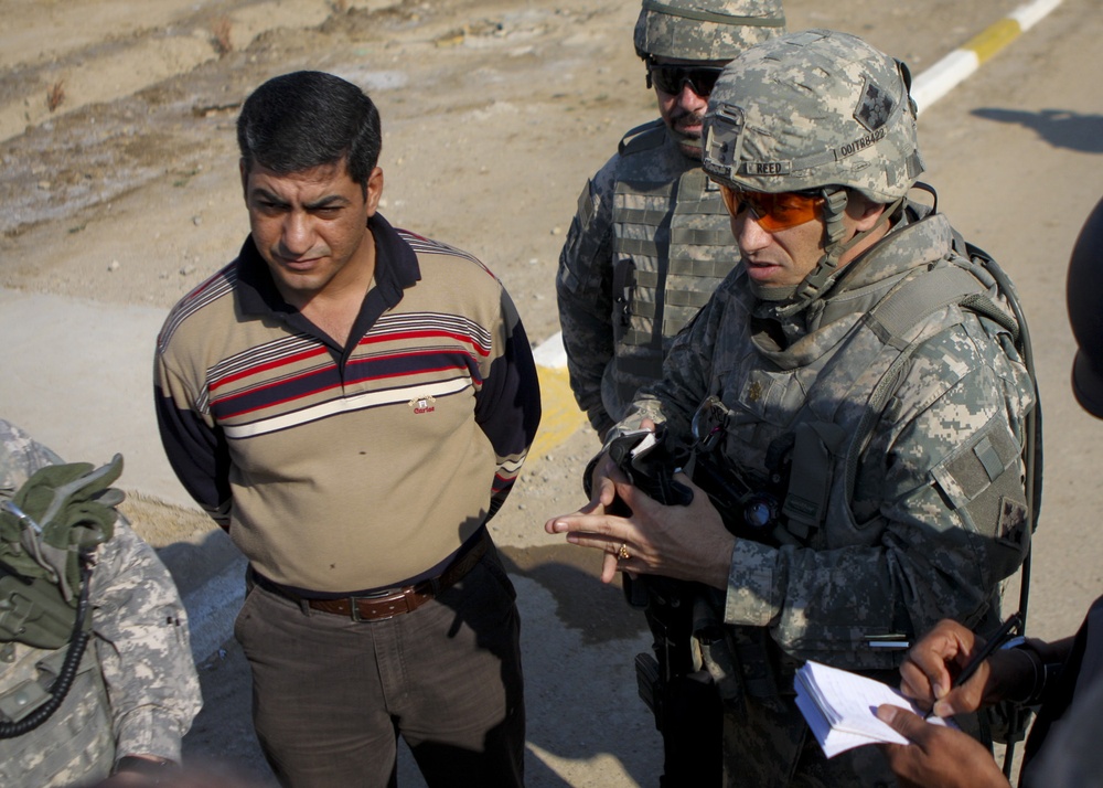 Iraqi government pays its 'Sons': West Rashid Sons of Iraq receive first government of Iraq paycheck