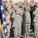 Members of Combined Security Transition Command - Afghanistan stand at attention during the playing of Taps at the Veterans Day ceremony at Camp Eggers in Kabul, Nov. 11, 2008. More than 200 U.S. and coalition forces service members attended the ceremony