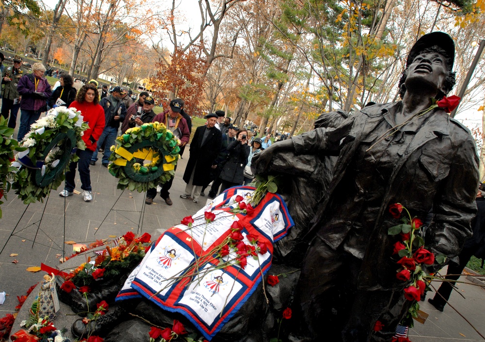 Visitors gather around the Vietnam Women's Memorial as part of the Veterans Day Observance at the Vietnam Wall Nov. 11, 2008 in Washington, D.C. The day also marks the 15th Anniversary Vietnam Women's Memorial opening.