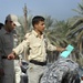 Iraqi national police distribute paychecks to Sons of Iraq
