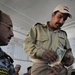 Iraqi national police distribute paychecks to Sons of Iraq