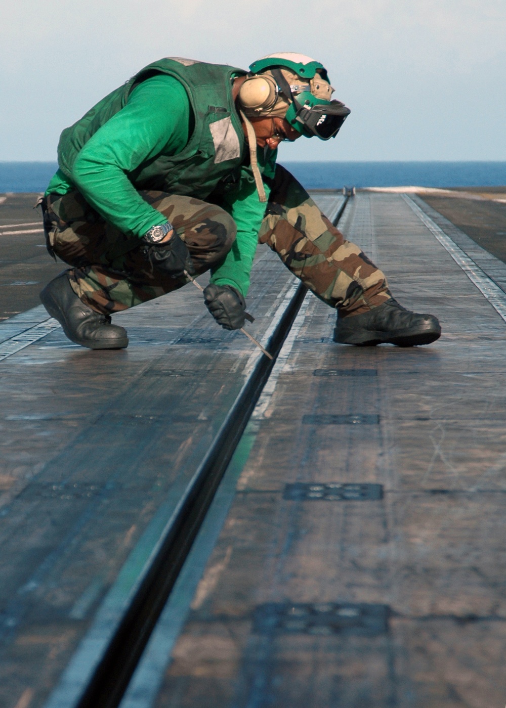 Filing down burs aboard the USS George Washington