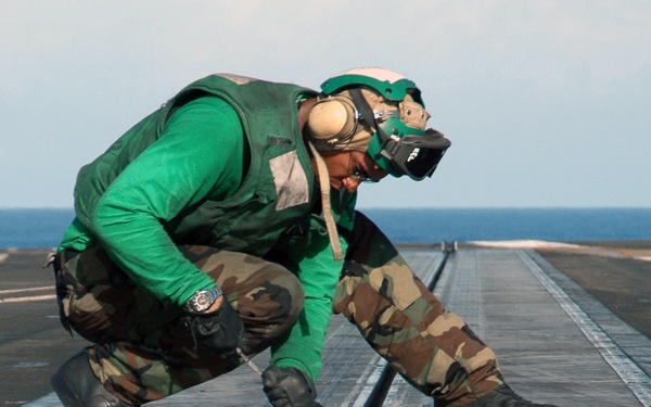 Filing down burs aboard the USS George Washington