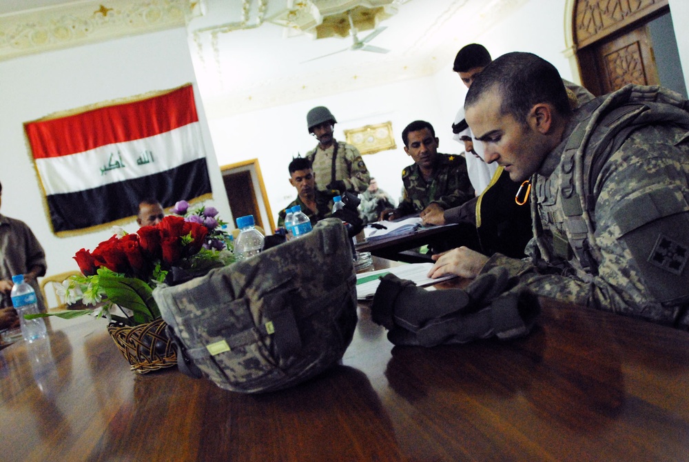 Raider Soldiers oversee Hayys Jihad and Furat Sons of Iraq's first payday under government of Iraq