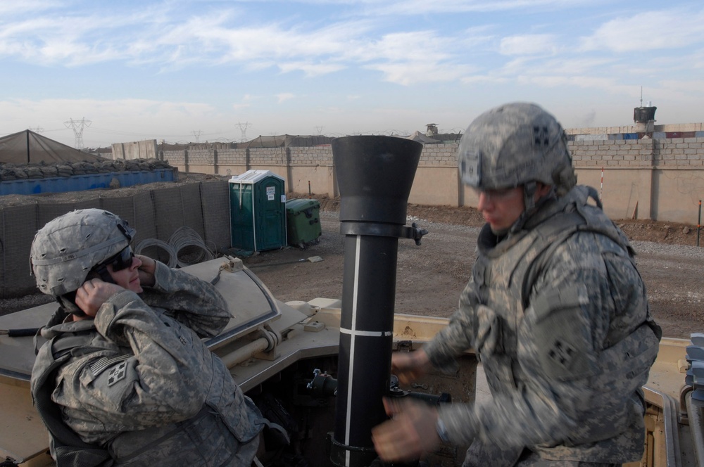 Regulars lob mortar rounds at Forward Operating Base Falcon