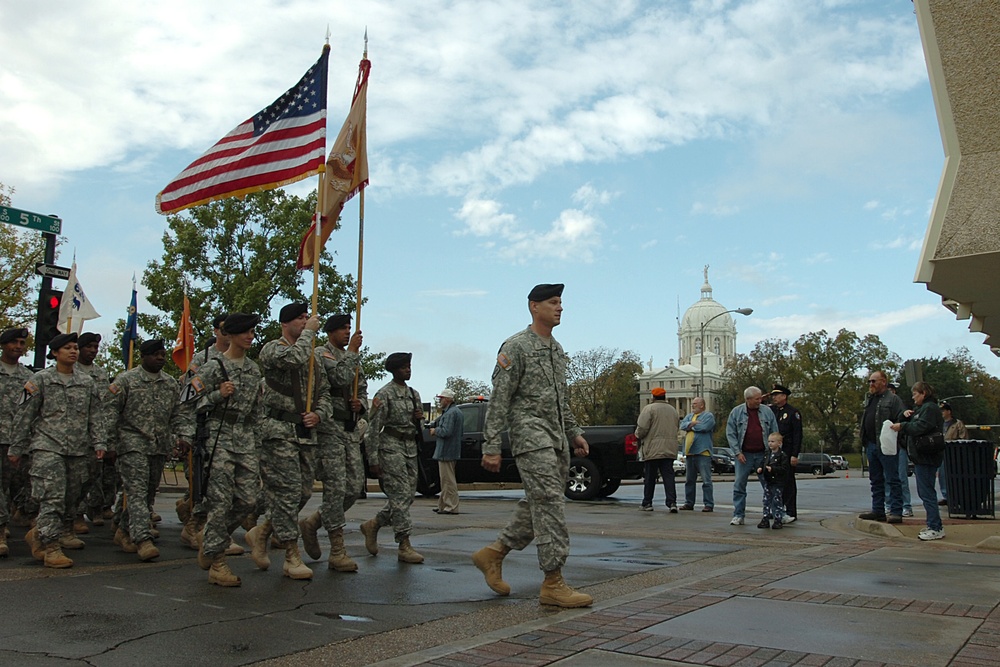 Hundreds of spectators gathered as Lt. Col. Dean Keck (front), commander of the 615th &quot;Cold Steel&quot; Aviation Support Battalion, 1st Air Cavalry Brigade, 1st Cavalry Division, leads some of his Soldiers through the streets of Waco, Texas, during their annua