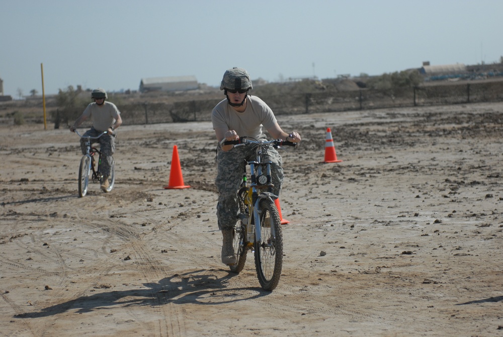 Fresno, Calif., native Capt. Philip Durando, commander, Company C, 589th Brigade Support Battalion, 41st Fires Brigade, poses while racing in the Forward Operating Base Delta Veterans Day Bike Race Nov. 11 at the FOB softball field. The idea for the race