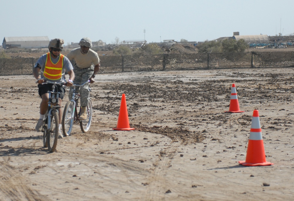 Chicago native Spc. Sergio Dixon, chaplain's assistant, 2nd Battalion, 20th Field Artillery Regiment, 41st Fires Brigade, leads his first sergeant, 1st Sgt. Donald Wilson, of Paducah, Ky., Headquarters and Headquarters Battery, 2-20 FA, in the Forward Ope