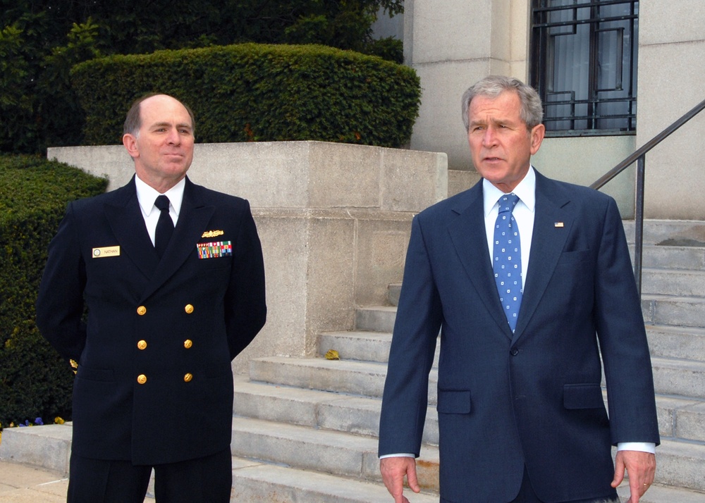 Bethesda Commander Adm. Matthew L. Nathan escorts President George. W. Bush as he exits Bldg. 1 of the National Naval Medical Center. President Bush visited wounded service members in recognition of Veterans Day.