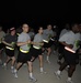 Members of the U.S., British, and Iraqi military take off from the starting line for the 10k Veterans Day memorial run at Forward Operating Base Rustamiyah, Iraq, on Nov. 11, 2008.