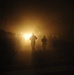 U.S., British, and Iraqi military members run during the 10k Veterans Day memorial run at Forward Operating Base Rustamiyah, Iraq, on Nov. 11, 2008.