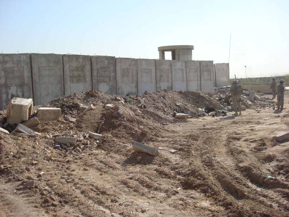 Army engineers help beautify, build up neighborhoods in Iraq - Multi-National Division - Baghdad engineers clear the way for contractors to take over trash pickup
