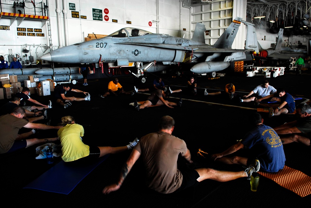 Sailors, Marines participate in physical training session aboard USS John C. Stennis