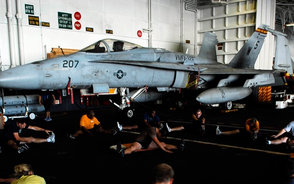 Sailors, Marines participate in physical training session aboard USS John C. Stennis