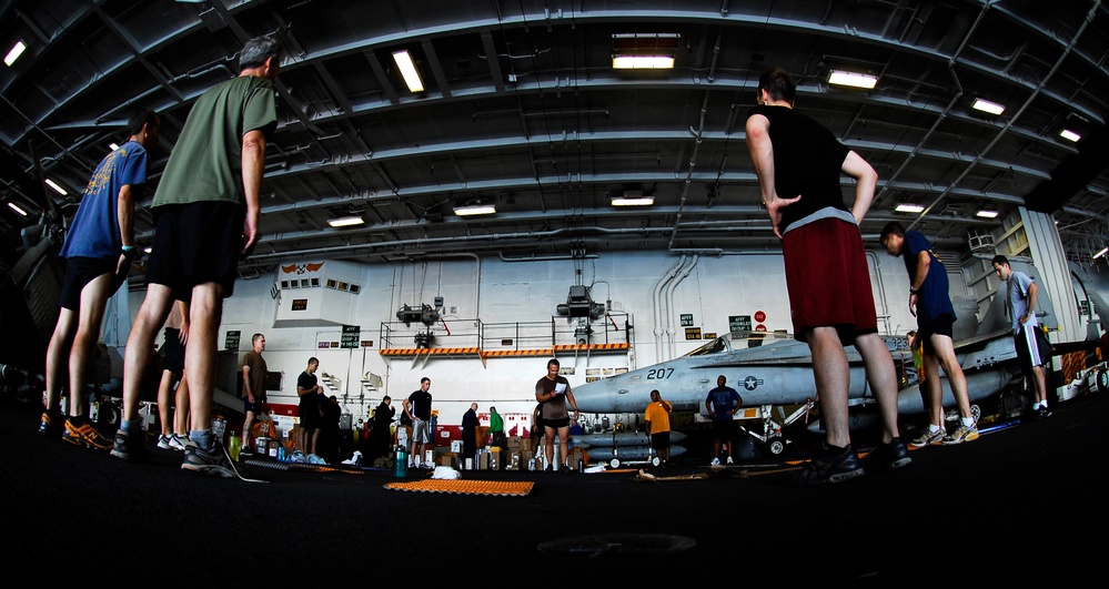 Sailors, Marines participate in physical training session aboard USS John C. Stennis