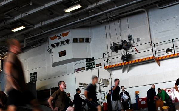 Sailors, Marines participate in physical training session aboard USS John C. Stennis