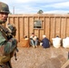In action at Camp Shelby