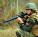 In action at Camp Shelby