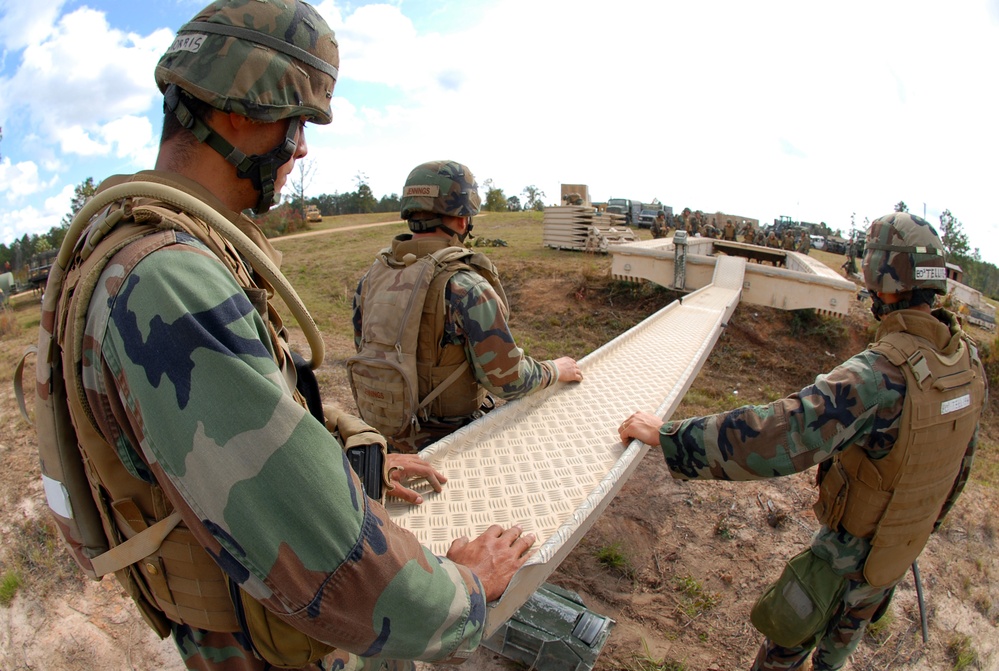 In action at Camp Shelby