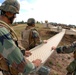 In action at Camp Shelby