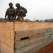 In action at Camp Shelby