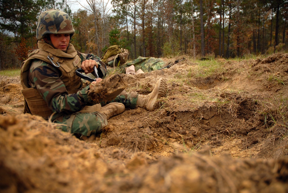 In action at Camp Shelby