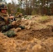 In action at Camp Shelby