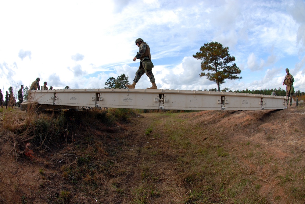 In action at Camp Shelby