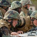 In action at Camp Shelby