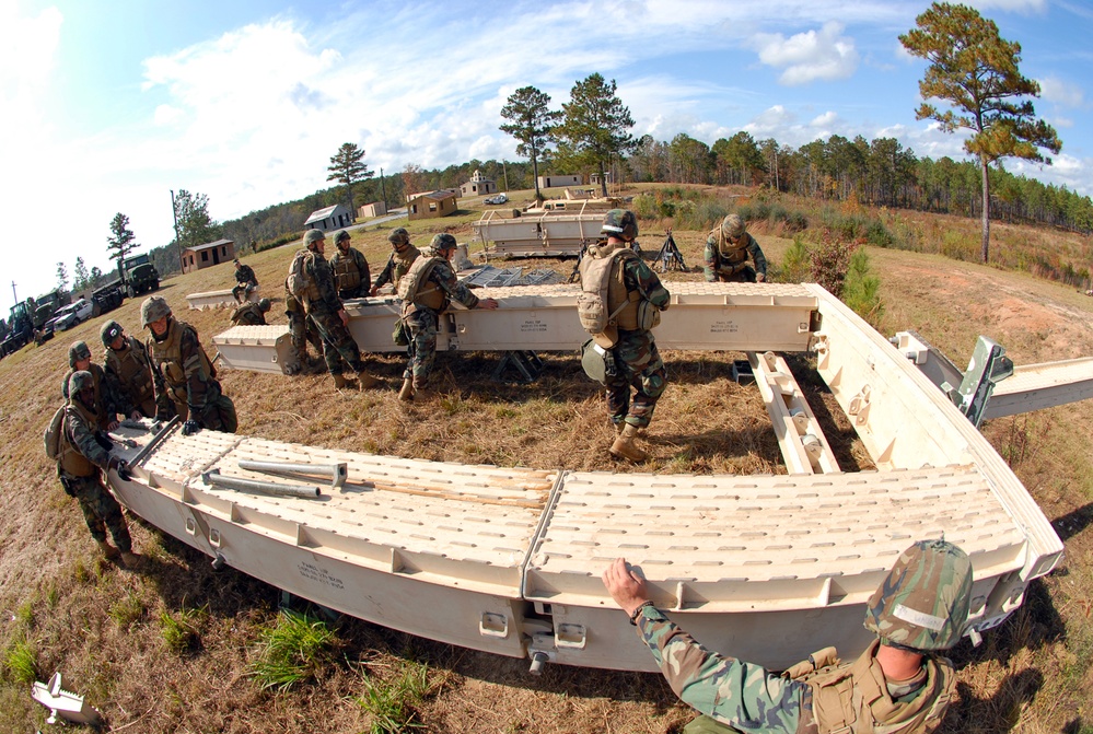 In action at Camp Shelby
