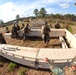 In action at Camp Shelby