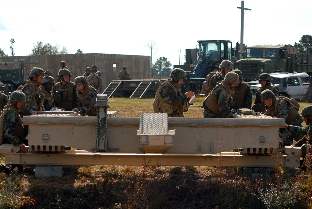 In action at Camp Shelby