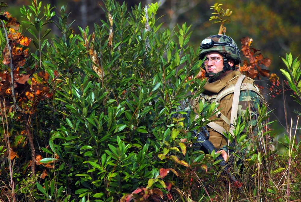 In action at Camp Shelby
