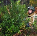 In action at Camp Shelby