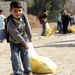 Iraqi, U.S. Soldiers team up with El Salvadoran army to distribute food