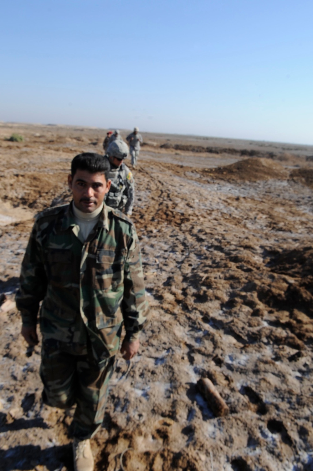 Iraqi army Explosive Ordnance Disposal team clear base of old munitions