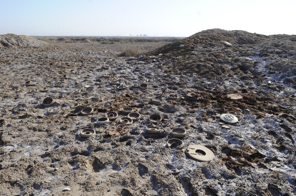 Iraqi army Explosive Ordnance Disposal team clear base of old munitions