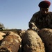 Iraqi army Explosive Ordnance Disposal team clear base of old munitions