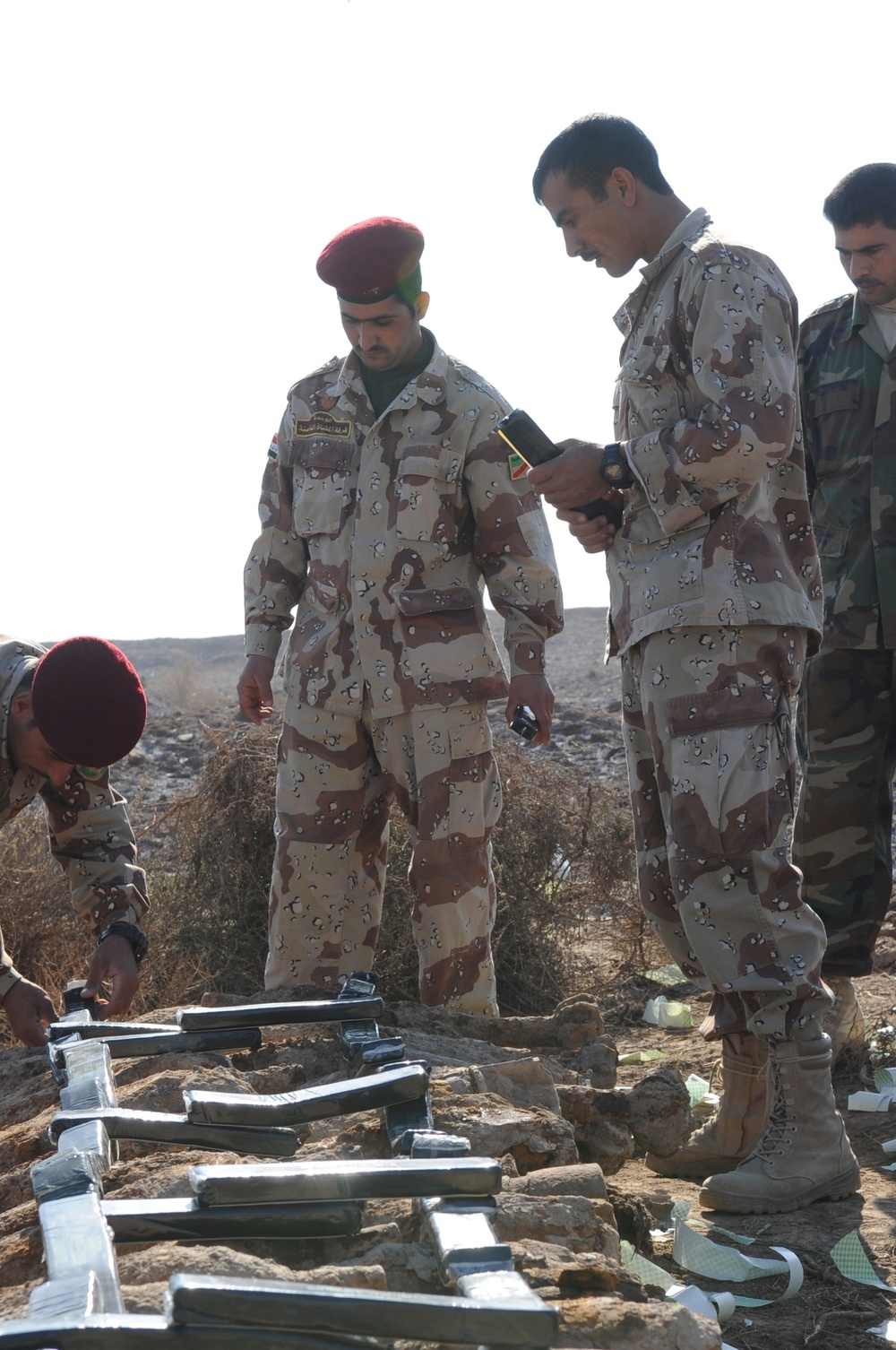 Iraqi army Explosive Ordnance Disposal team clear base of old munitions