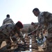 Iraqi army Explosive Ordnance Disposal team clear base of old munitions