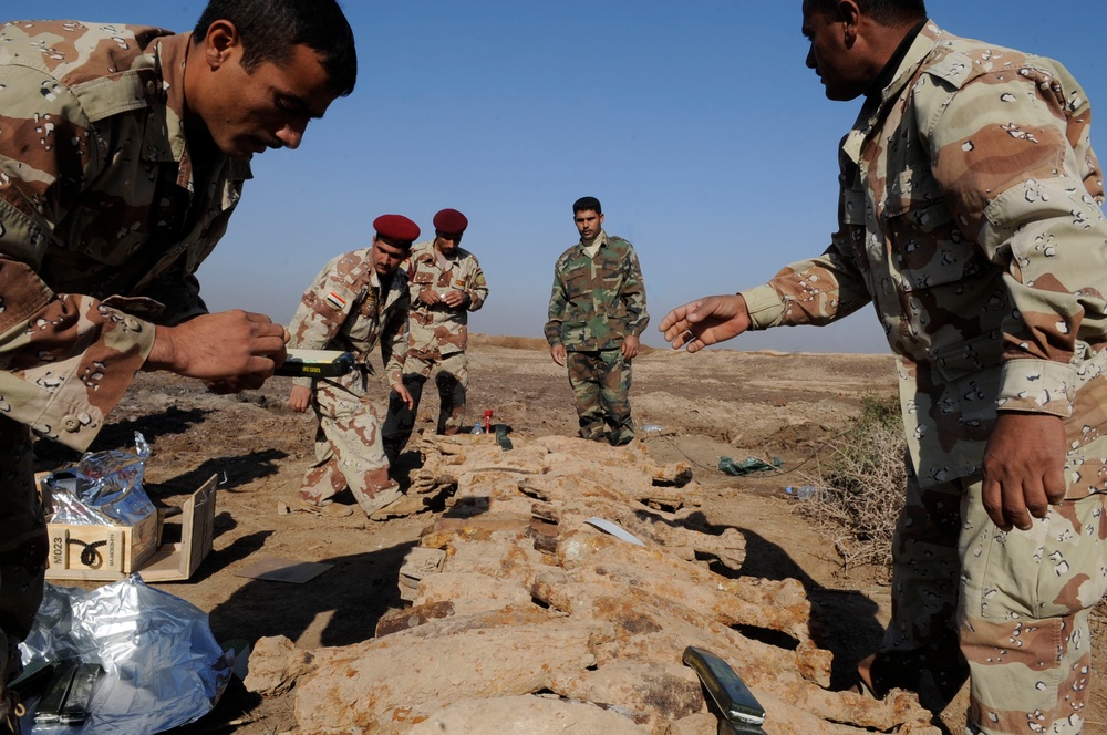 Iraqi army Explosive Ordnance Disposal team clear base of old munitions