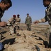 Iraqi army Explosive Ordnance Disposal team clear base of old munitions