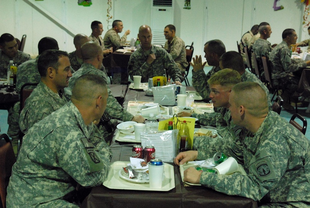 Multi-National Division - Baghdad Military Police Commander troops for 2nd straight deployed serving of Thanksgiving dinner