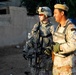 Iraqi army soldiers stand in lead during joint patrol