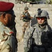 Iraqi army soldiers stand in lead during joint patrol