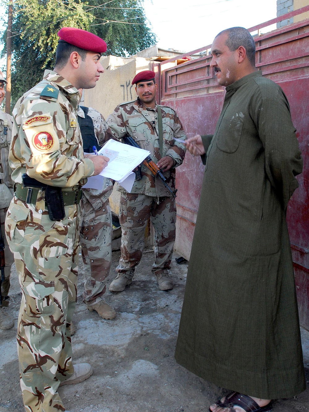 Iraqi army soldiers stand in lead during joint patrol